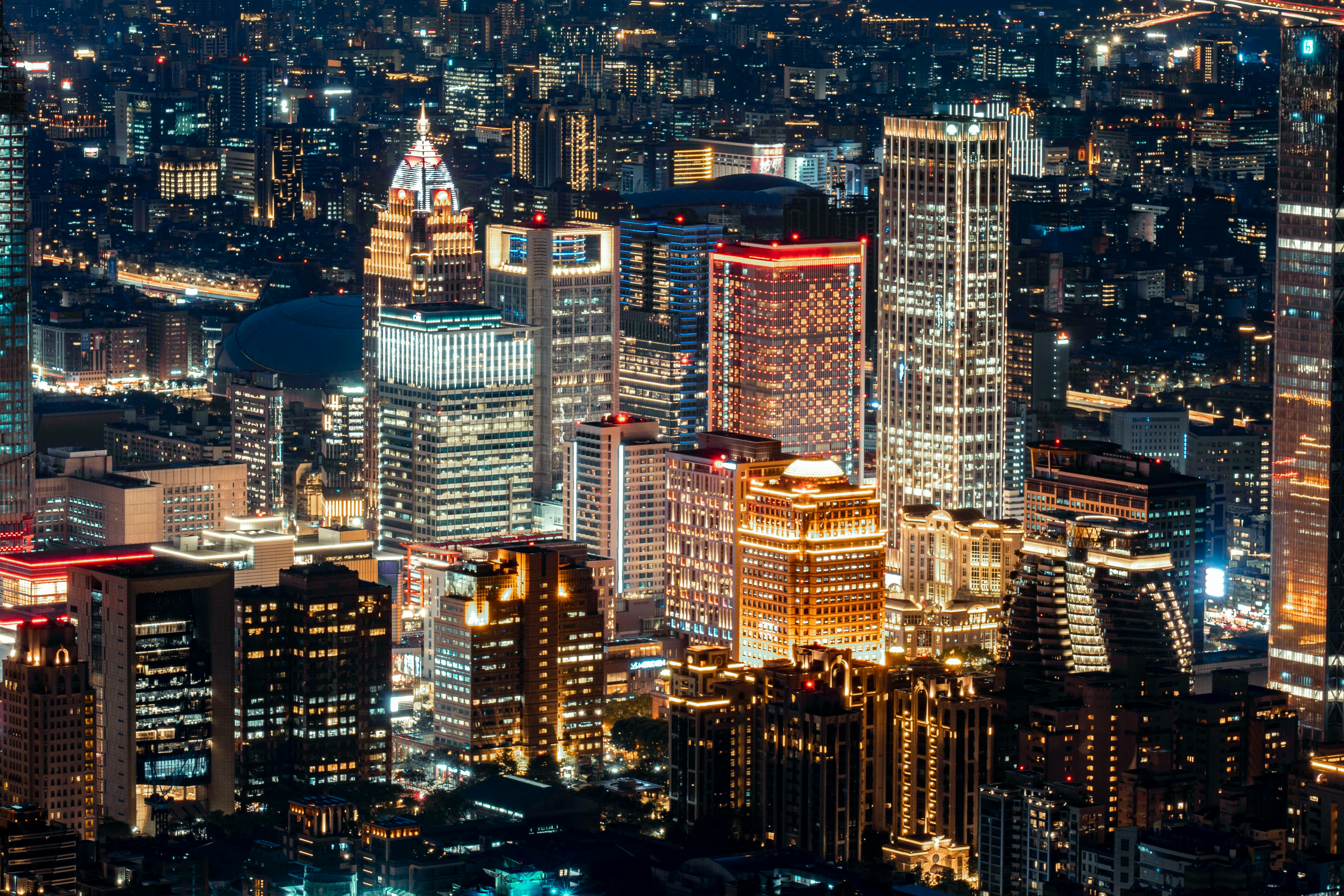 Illuminated Buildings in City at Night · Free Stock Photo