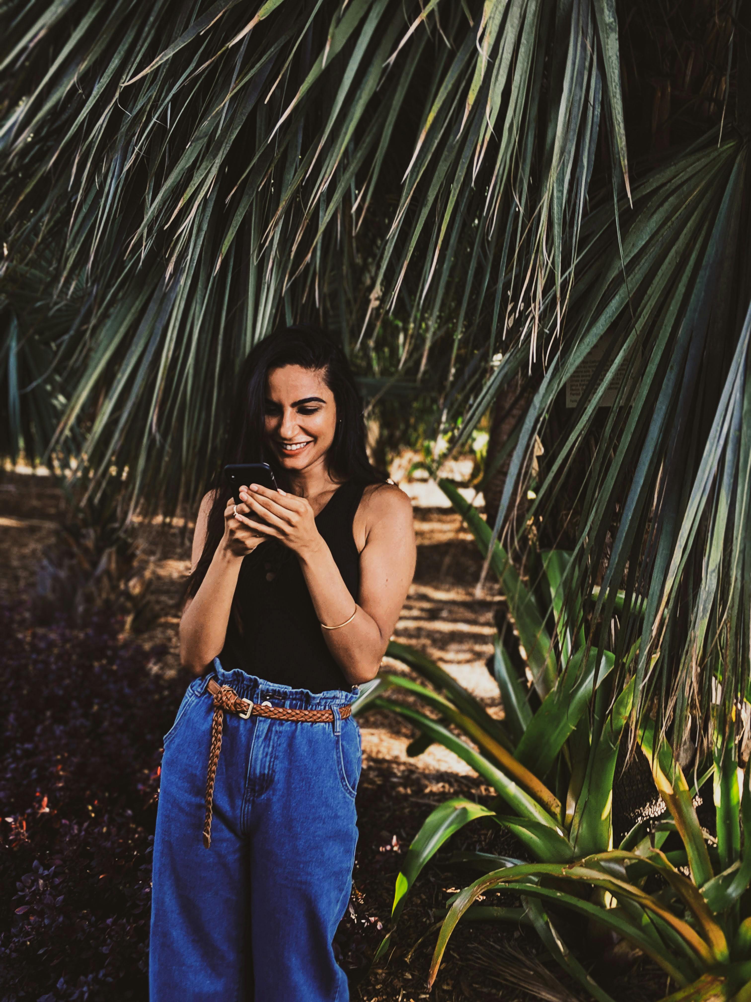 photo of woman using her mobile phone