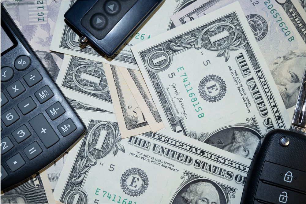 Illustrative photo of cash and car keys