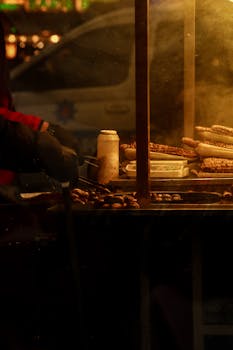 A vibrant scene of roasted chestnuts and corn on a street food stand in İstanbul, Turkey.