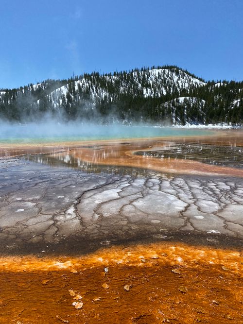 Free Colorful geothermal pool with steaming hot spring in Yellowstone National Park. Stock Photo