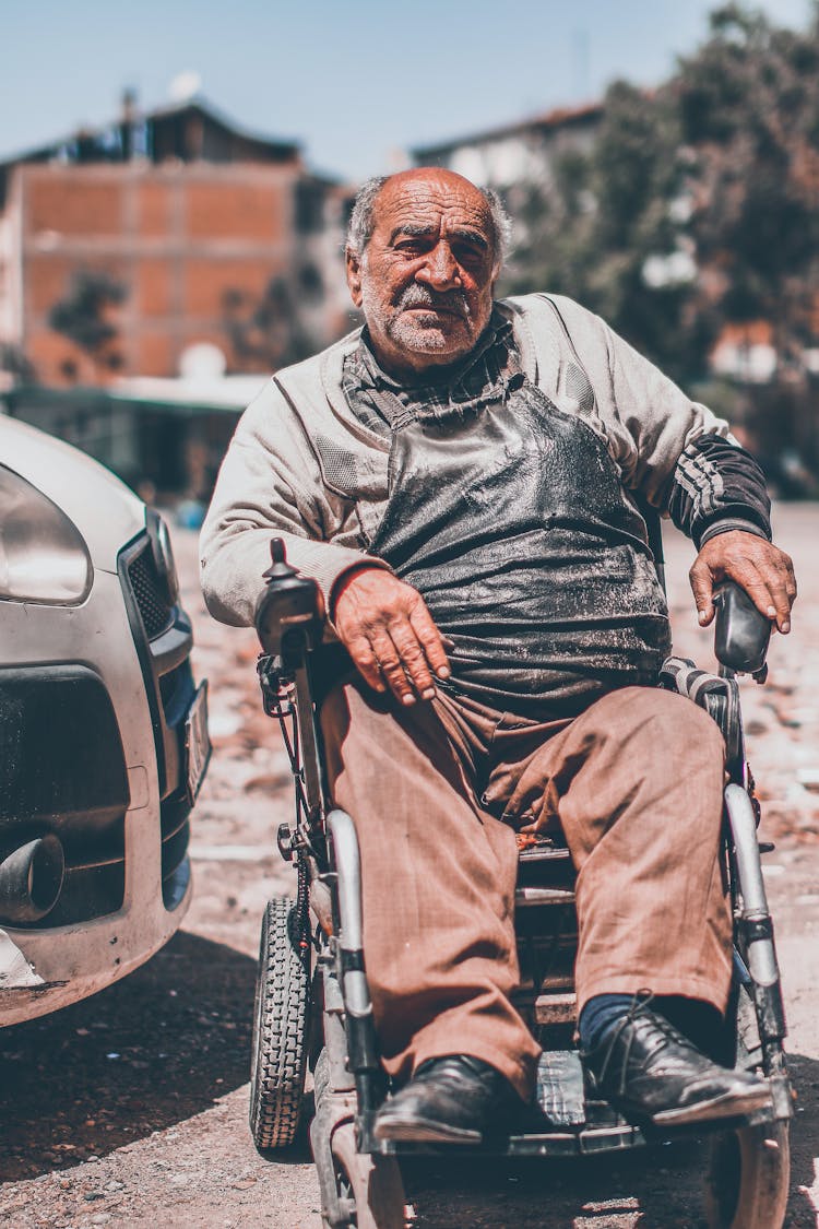 Elderly Man On Wheelchair