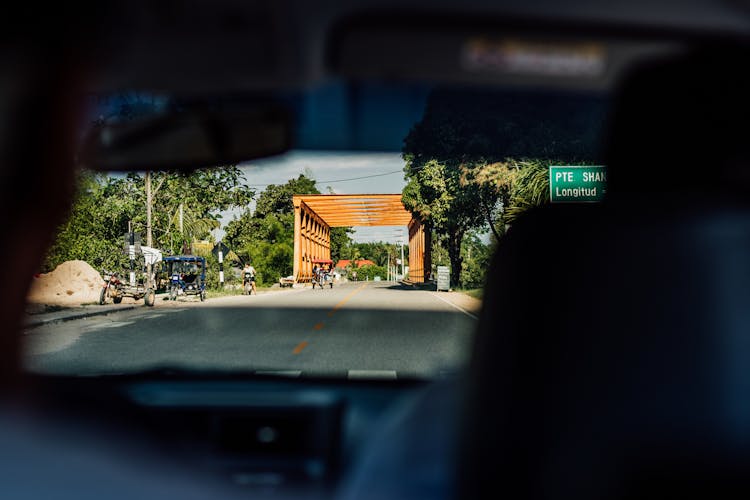 Car Driving Up Towards Bridge