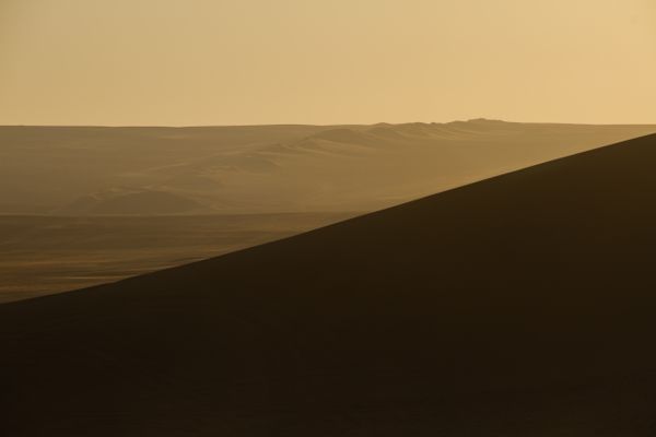 Barren desert landscape in pale light, photo by Camilo Sánchez on Pexels