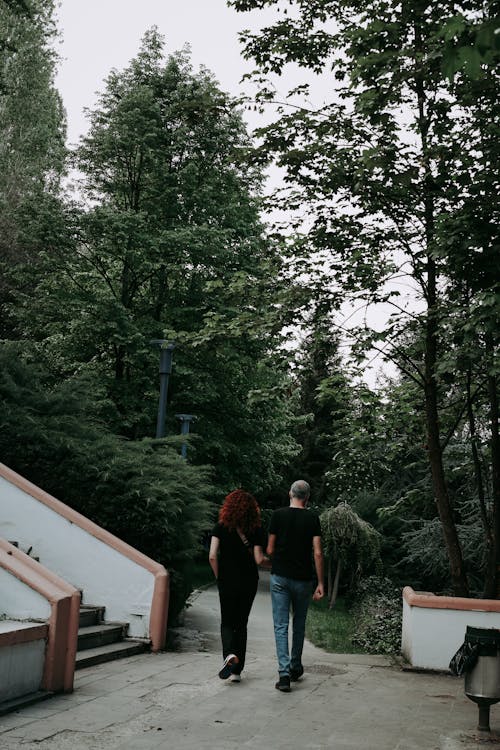 Couple Walking through Park Together