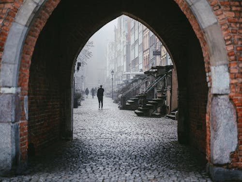 Free Old Town Gate and Cobblestone Street Stock Photo