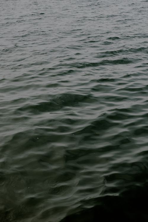 Free Serene view of the ocean surface with gentle ripples, perfect for a tranquil atmosphere. Stock Photo