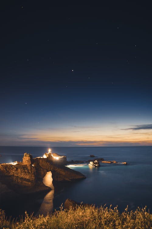 Lights on Sea Shore in Evening