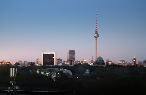 Free Beautiful twilight view of Berlin's skyline featuring the iconic TV tower and modern architecture. Stock Photo