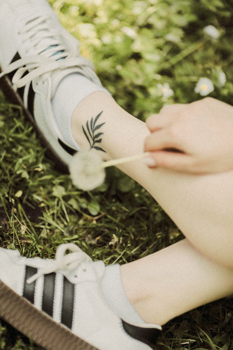 Dandelion On Woman Hand And Leaf Tattoo