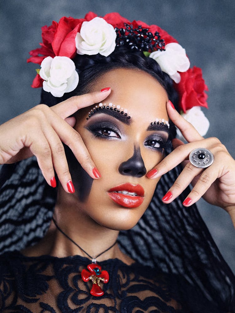 Portrait Of A Brunette Woman With Painted Face And An Artificial Wreath