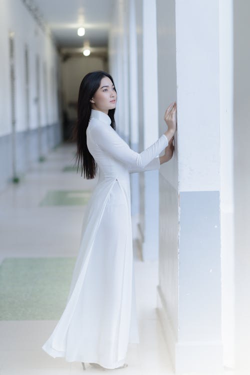 Young Elegant Woman in a White Dress 