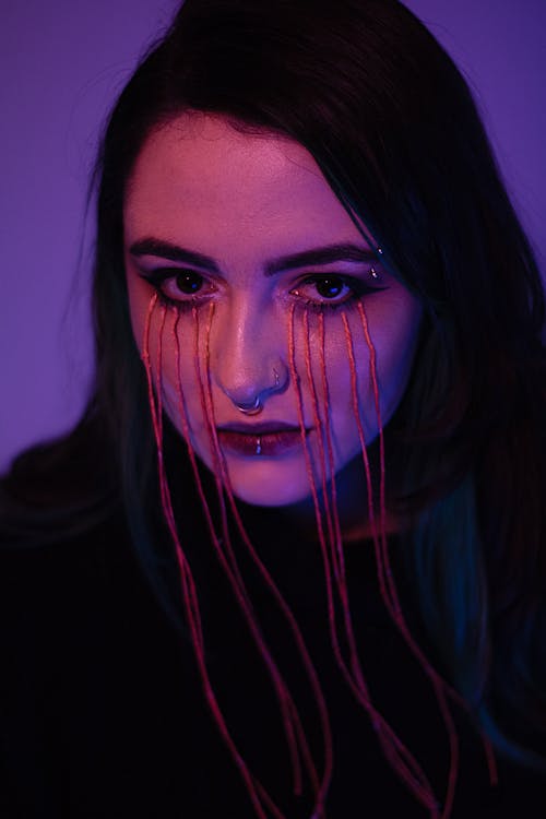 Purple Toned Portrait of a Woman with a Spooky Makeup