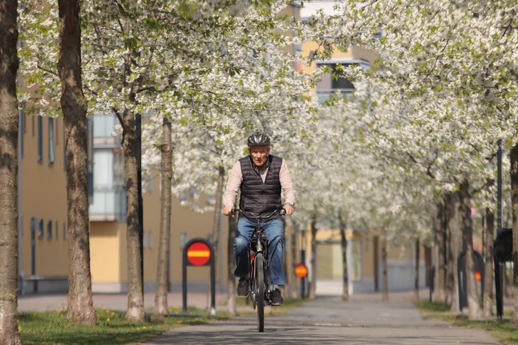 Man Riding On Bike In Spring