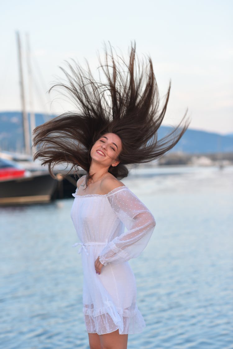 Woman Posing With Hair Over Head