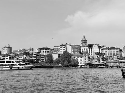 Free Black and white cityscape of Istanbul featuring Galata Tower by the Bosporus. Stock Photo