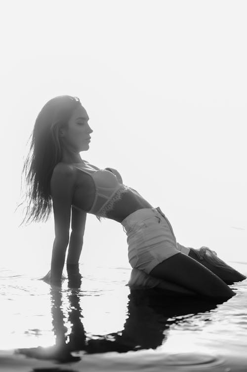 Beautiful Woman Kneeling in Water 