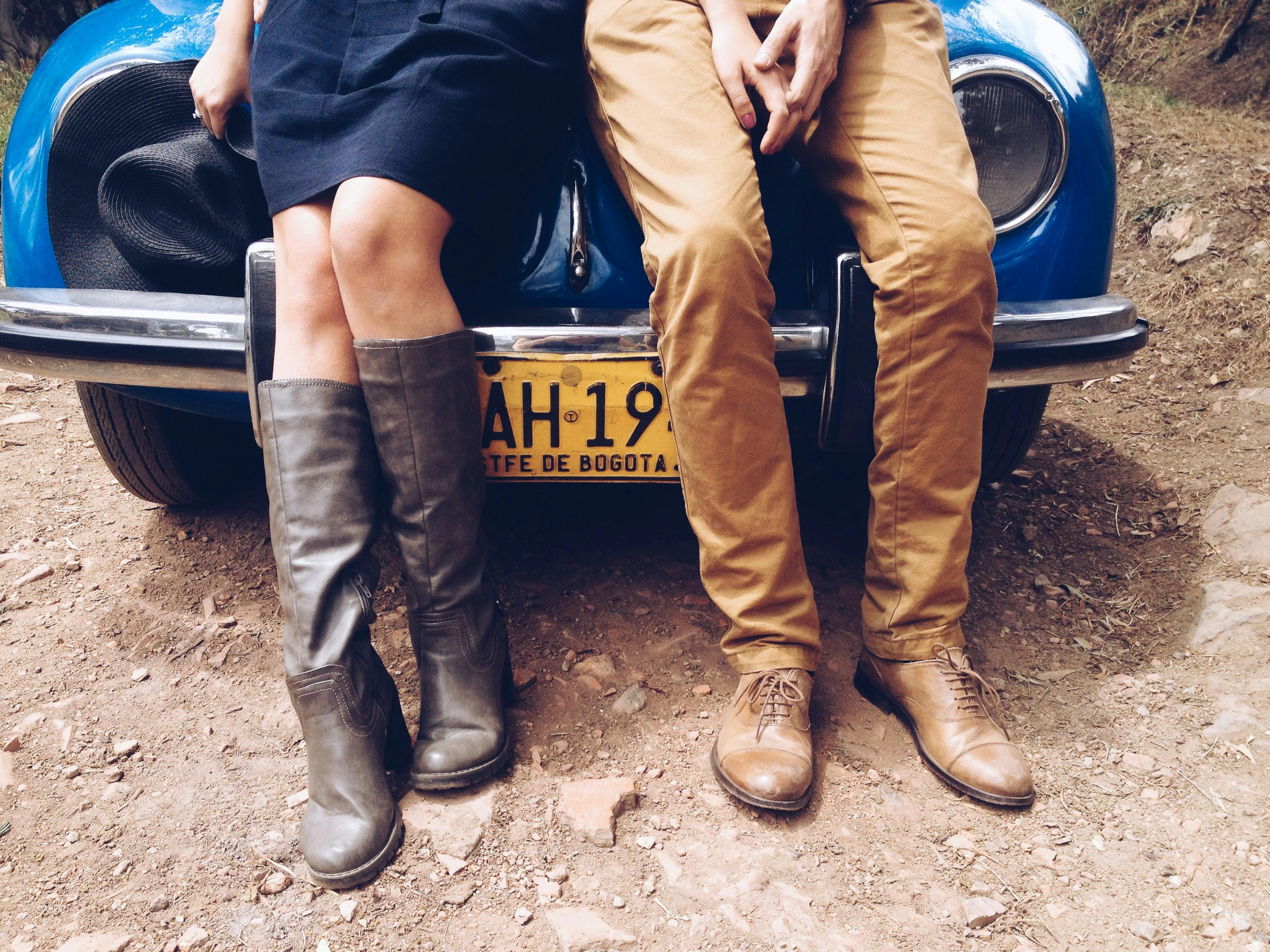 Free Man in Brown Pants and Brown Leather Boots Sitting on Yellow Car Stock Photo
