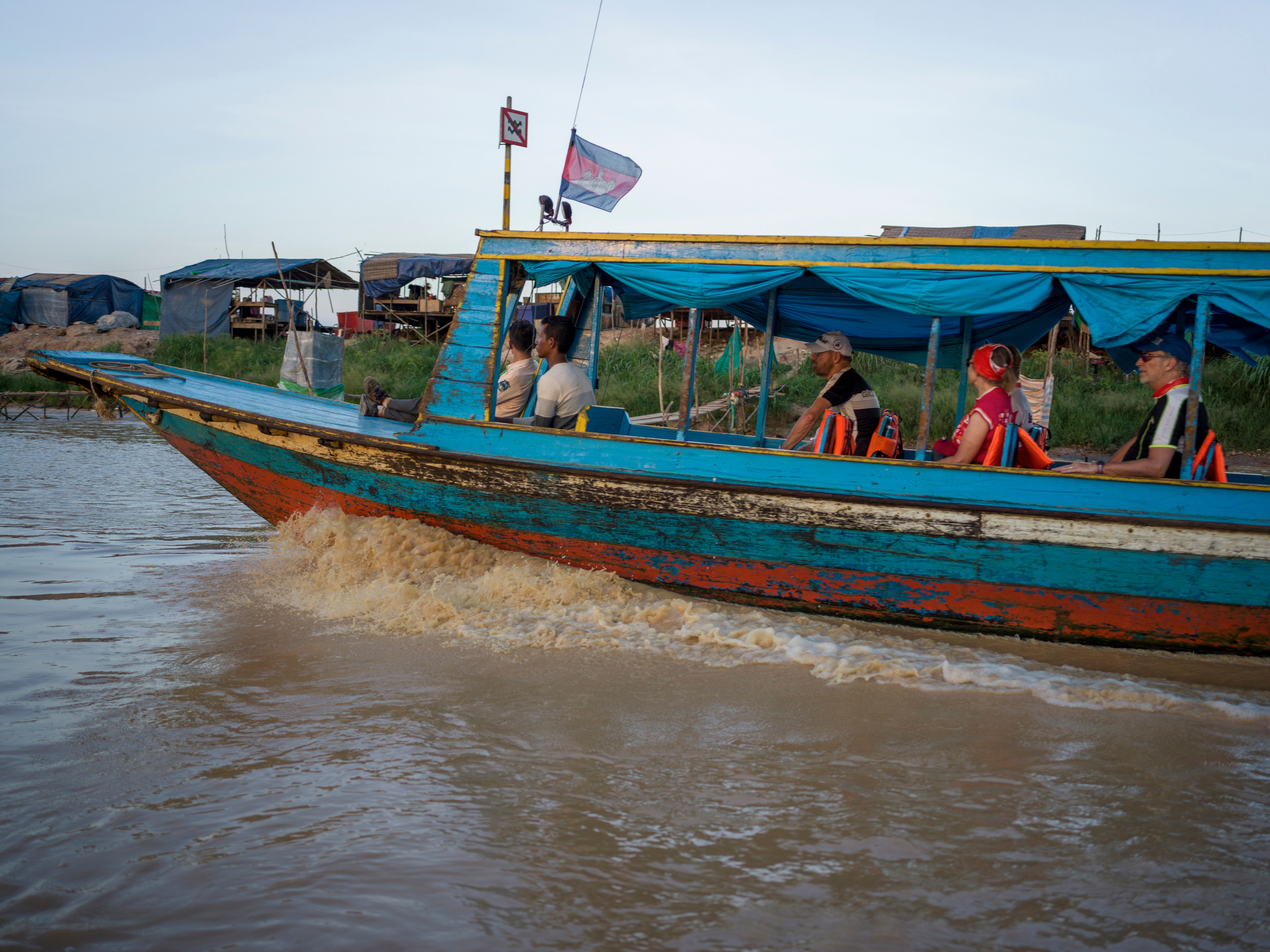 People on Motorboat on River in Cambodia · Free Stock Photo