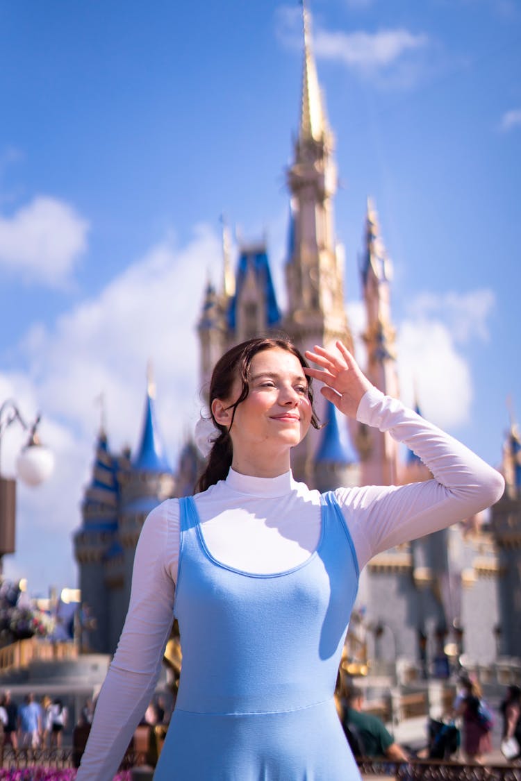 Woman Posing Against Disney Castle On Florida