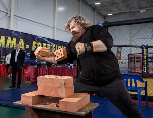 Strongman Punching Bricks