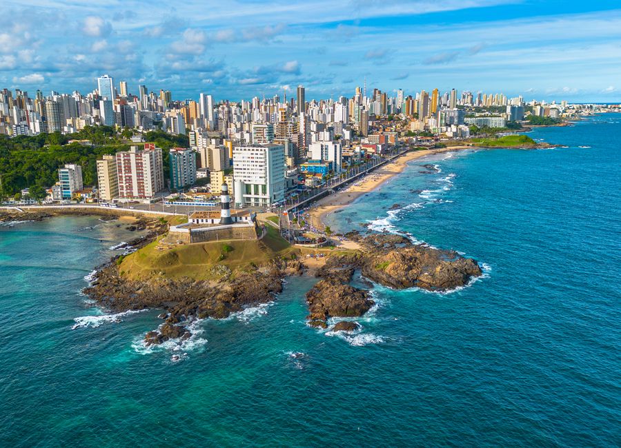 A vibrant aerial shot capturing Salvador, Bahia's coastline with its urban skyline and beach.