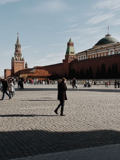 Free Iconic view of Moscow's Red Square showcasing the Kremlin towers and bustling urban life. Stock Photo