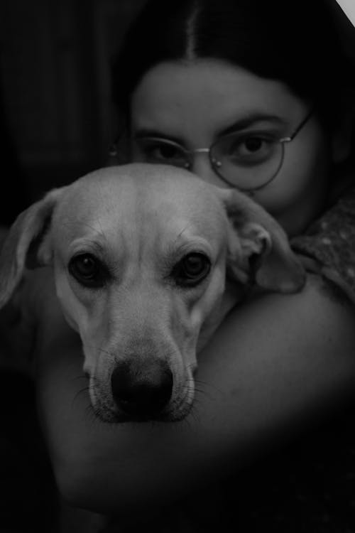 A Portrait of a Woman with a Dog in Black and White