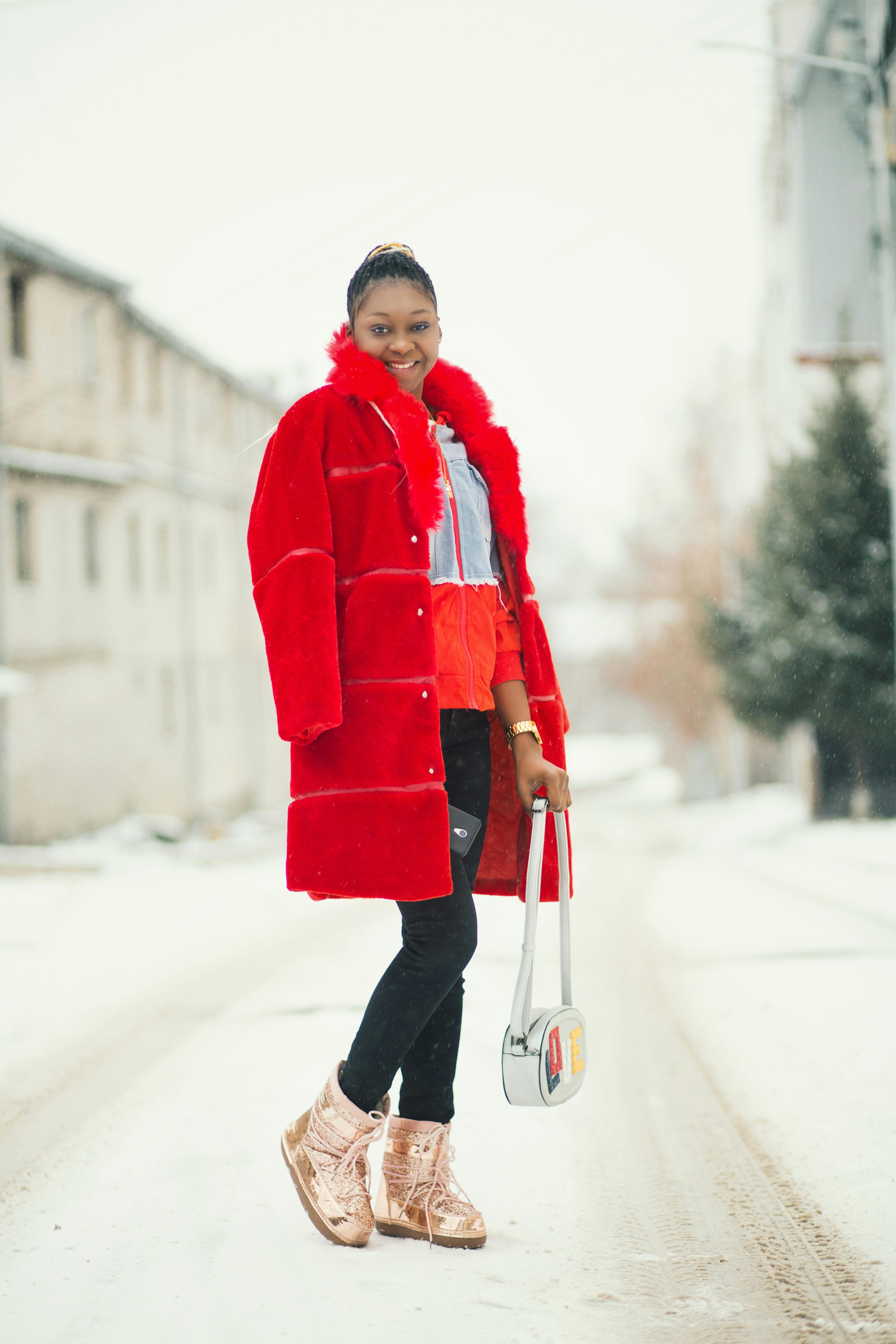 smiling woman holding white bag