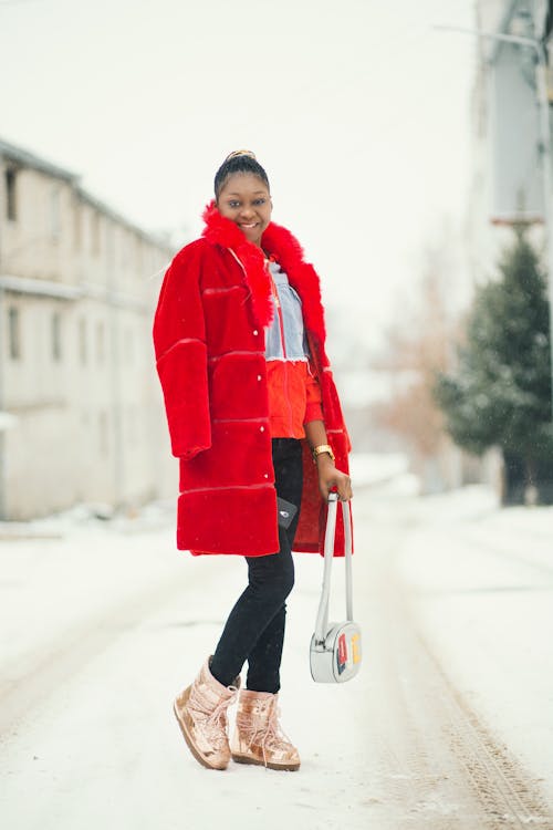 Smiling Woman Holding White Bag 