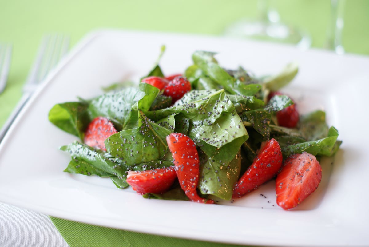 sliced strawberries and spinach a healthy Easter recipe