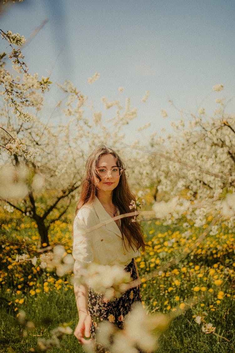 Woman Standing In Orchard