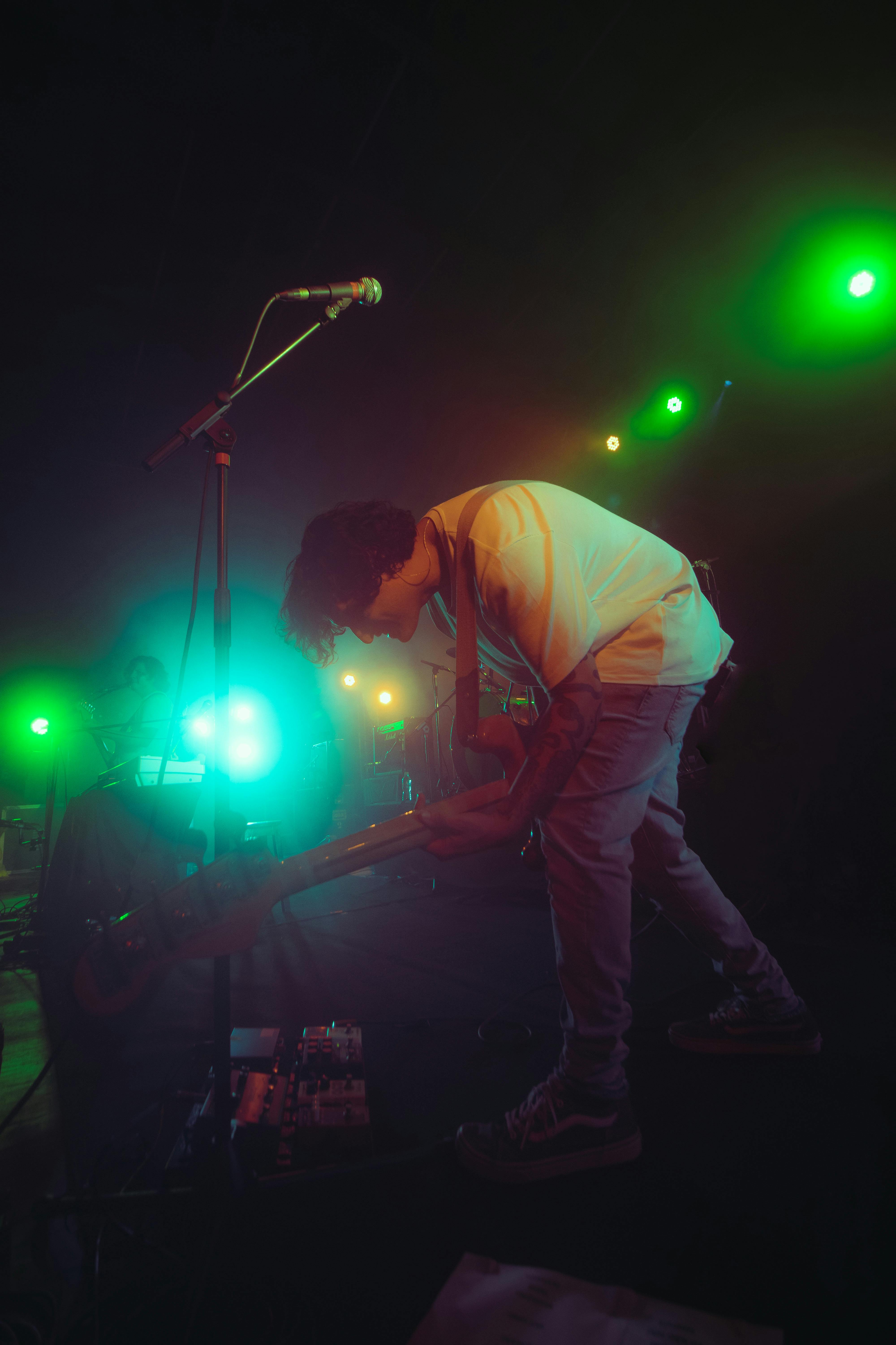 musician with guitar on concert