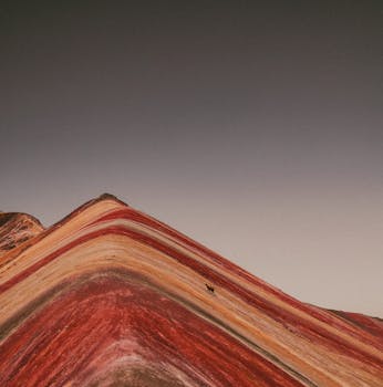 A mesmerizing aerial view of Cusco's iconic Rainbow Mountain with its vibrant natural stripes.