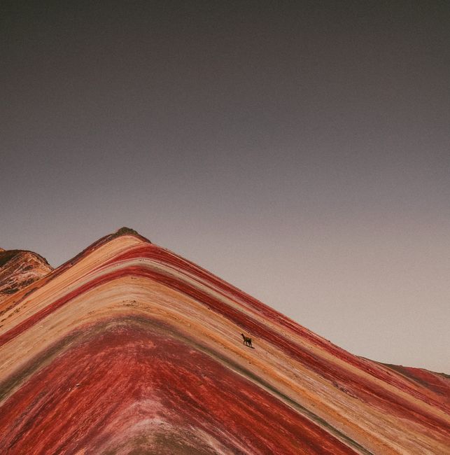 A mesmerizing aerial view of Cusco's iconic Rainbow Mountain with its vibrant natural stripes.