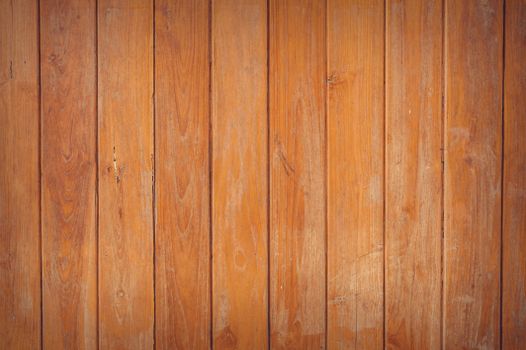Close-up of rustic wooden planks with a natural grain texture, ideal for backgrounds.