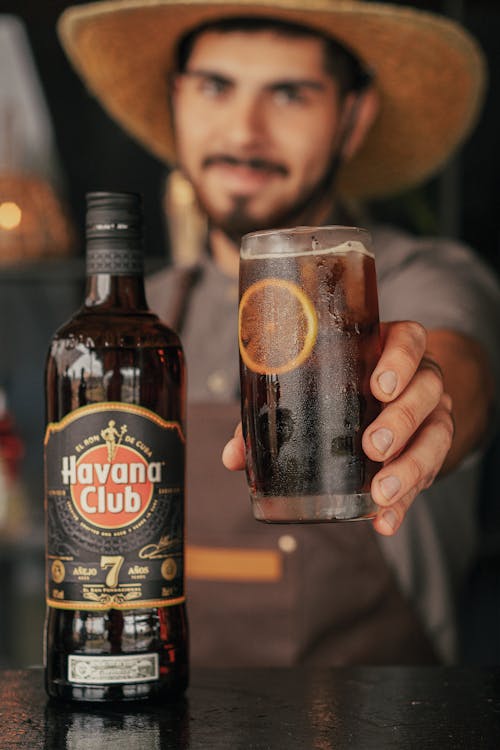 A Bartender Holding a Fresh Cocktail