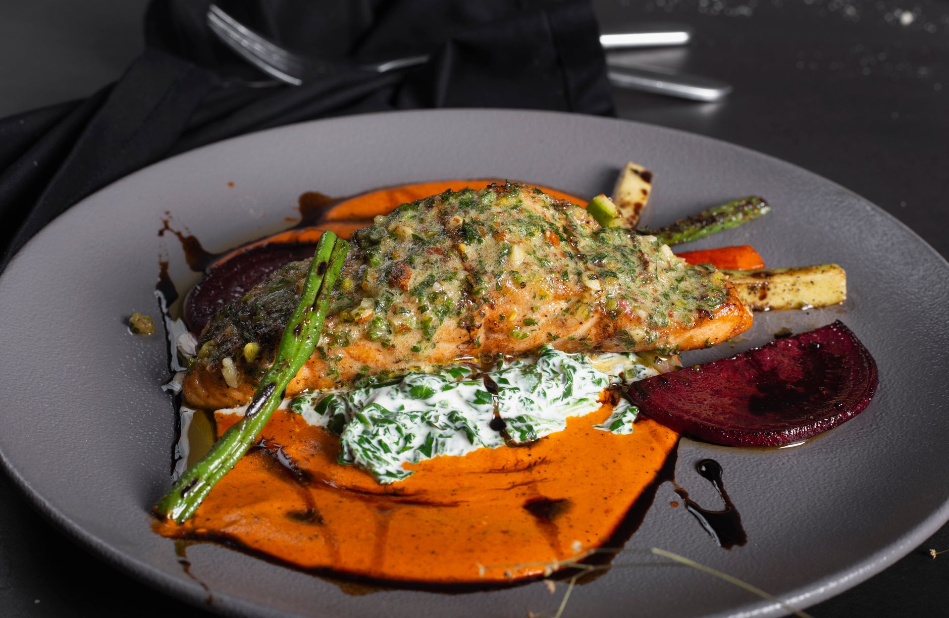 Salmon skin added as a topping on mixed vegetable salad