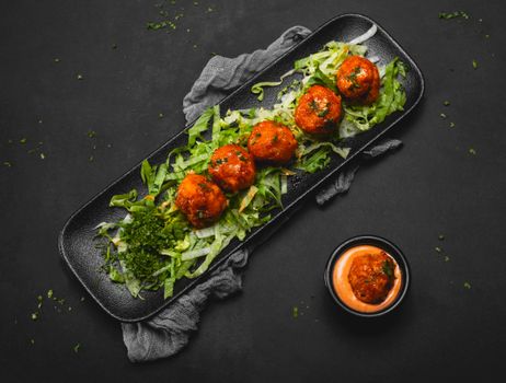 Meatballs on Salad on a Plate