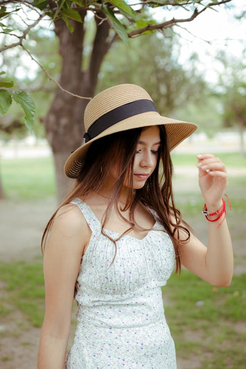 Brunette in Summer Dress and Hat