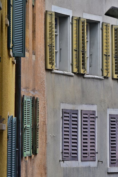 Close-up of a Residential Building Facade with Wooden Shutters 