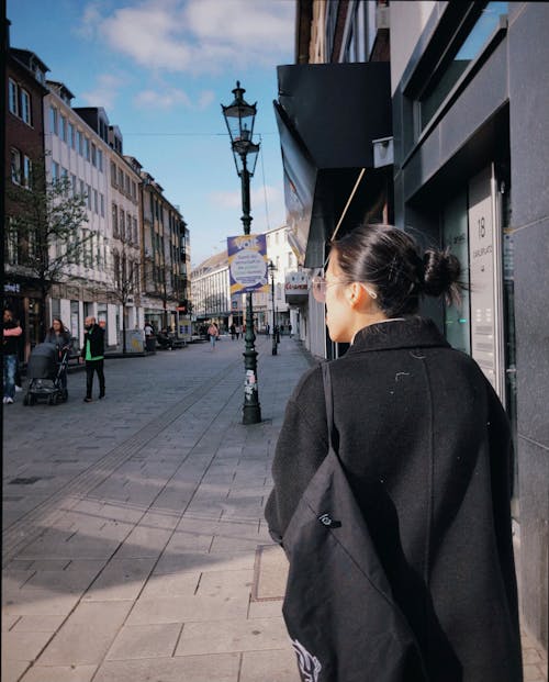 Back View of a Woman in Black Coat 