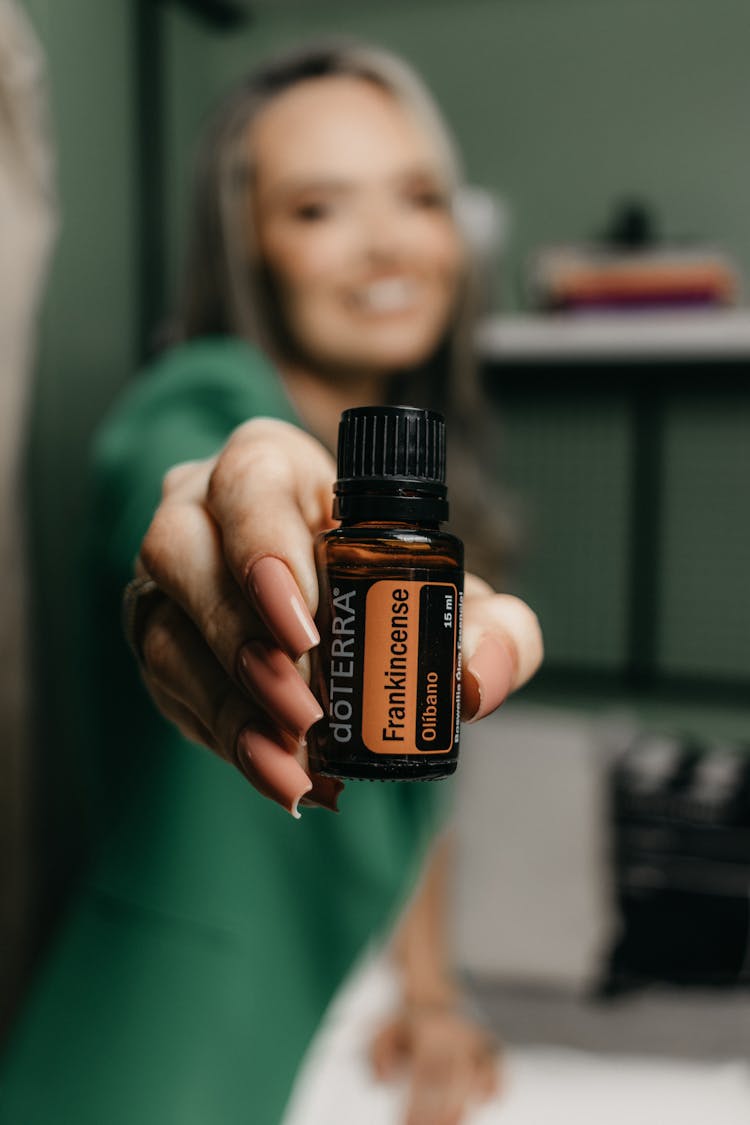 Small Vial In Woman Hand