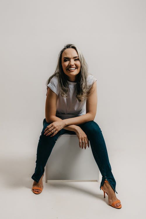 Studio Shot of a Young Woman in a Fashionable Outfit 