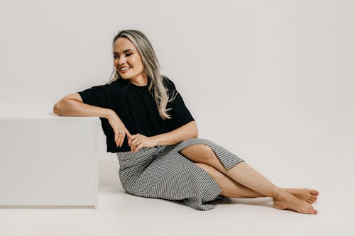 Studio Shot of a Young Woman in a Fashionable Outfit 