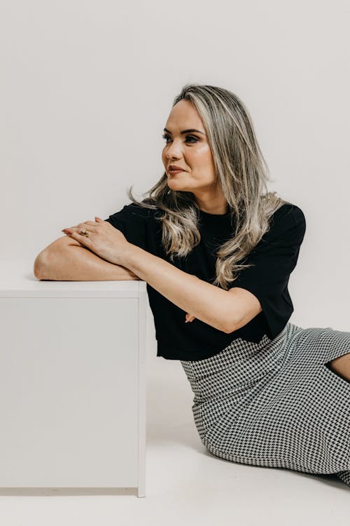 Studio Shot of a Young Woman in a Fashionable Outfit 