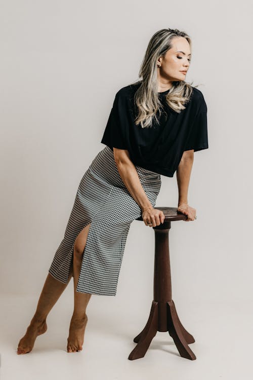 Model Leaning on Chair