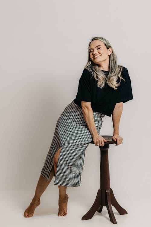 Blonde Woman Posing by Chair