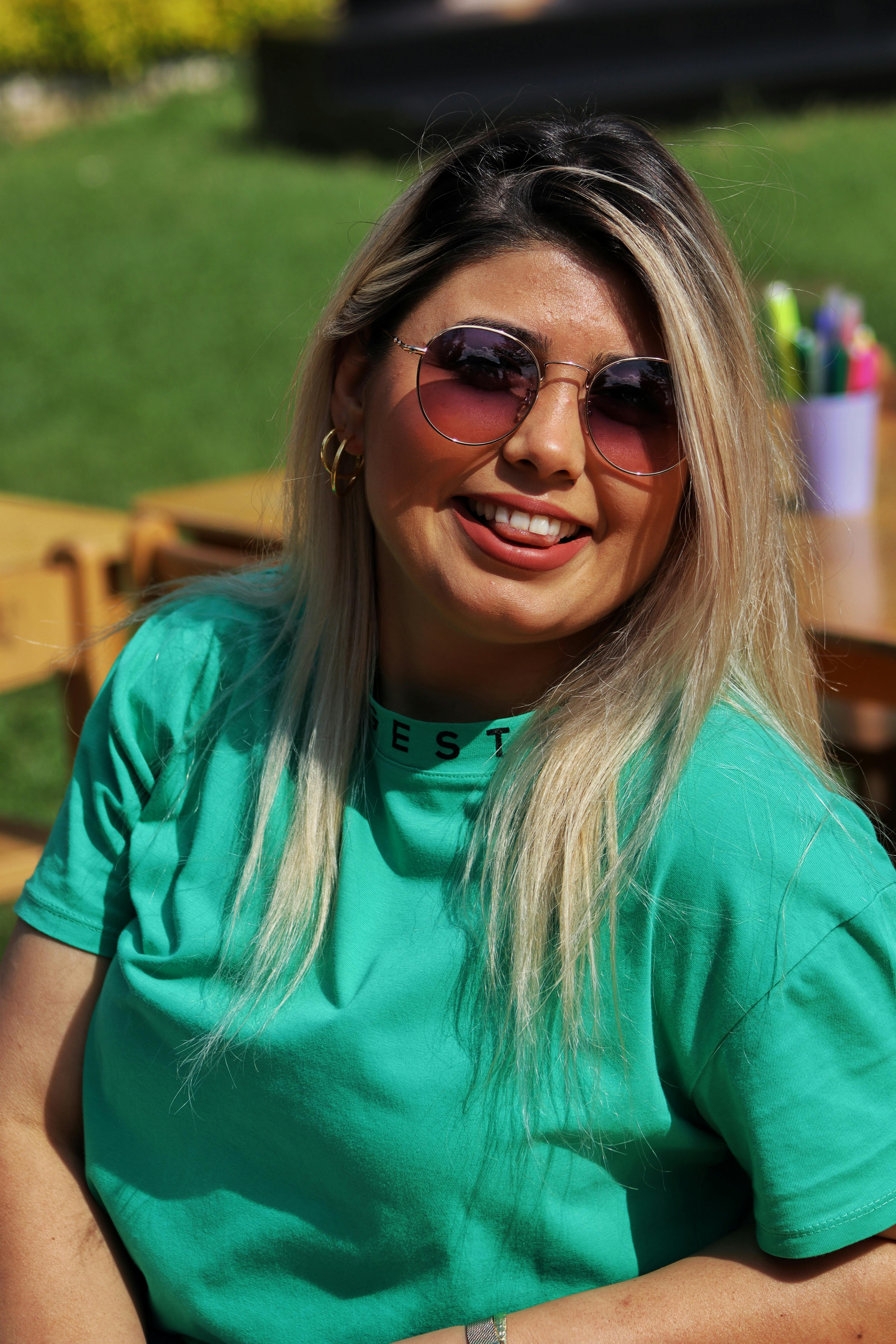 Young Woman in a Football Liverpool FC T-shirt · Free Stock Photo