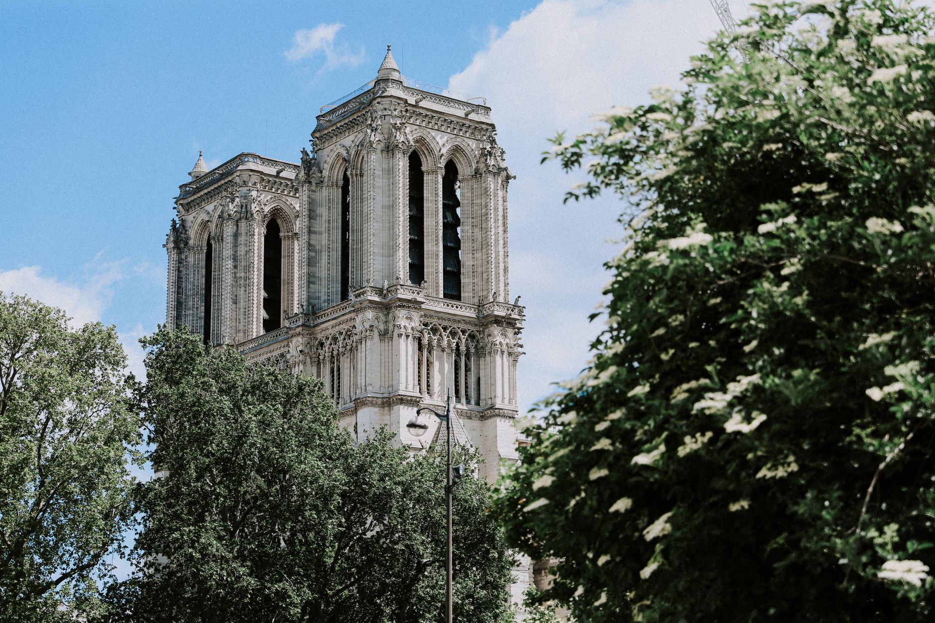 Notre-Dame Cathedral towers against a blue sky